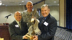 In February, Col. Michael Curry, USA (c), chapter president, and Michael Varner (l), incoming regional vice president (RVP), thank Philip Andreski, outgoing RVP, for his service to AFCEA. 